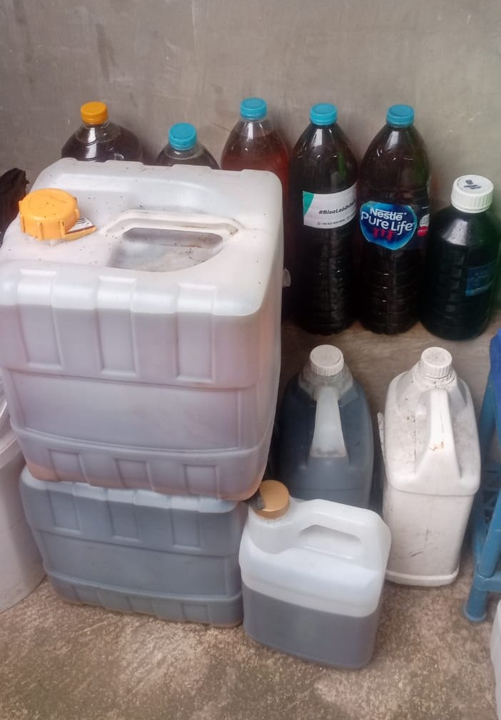 Collected used cooking oil bottles ready for pickup, part of Langgi's simple MVP collection system